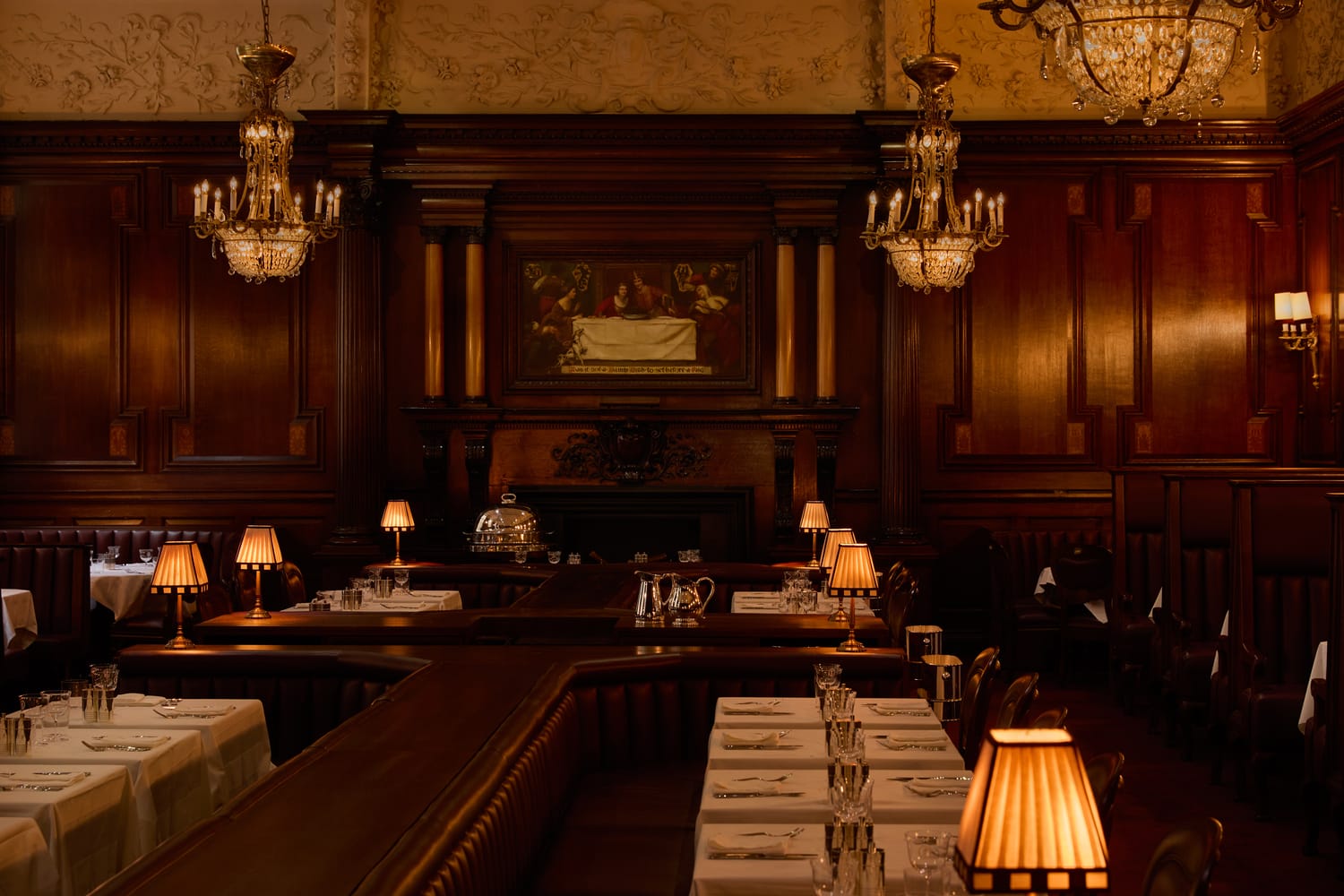 Working fireplace beneath relamped chandeliers.