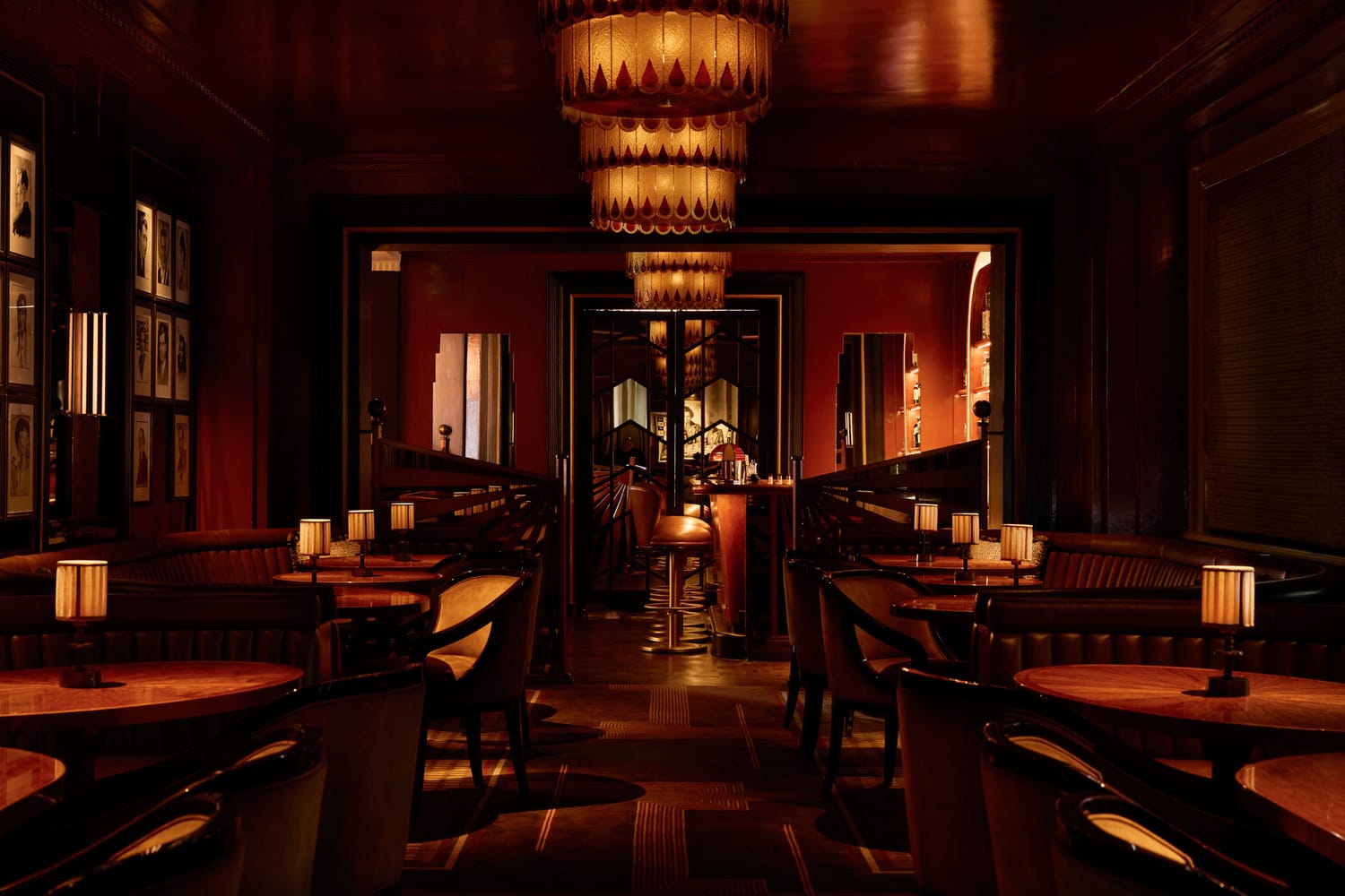 Simpson's Bar at Simpson's in the Strand with tiered chandelier and burgundy lacquered walls