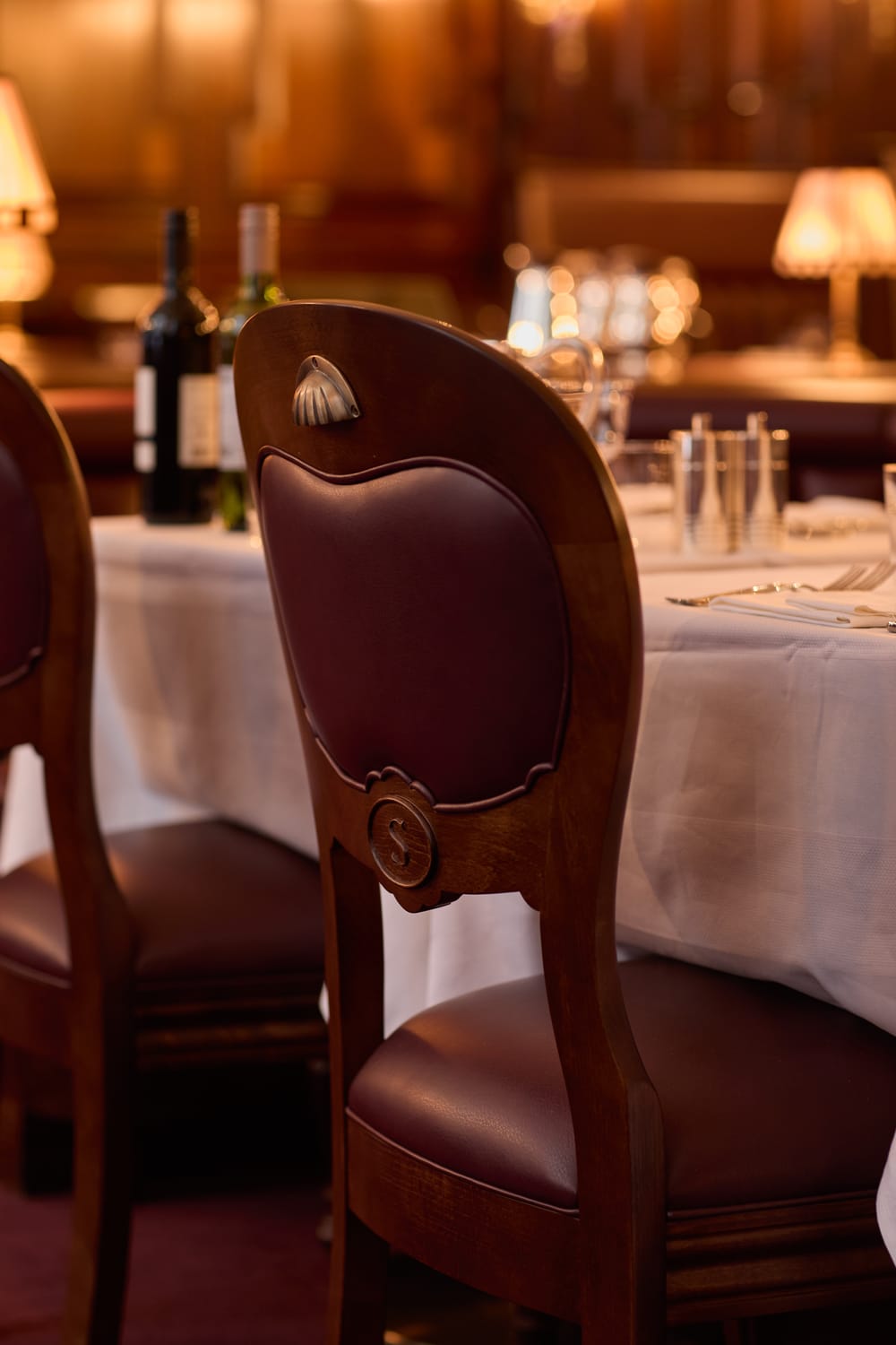 Leather dining chair with bespoke detailing at Grand Divan London