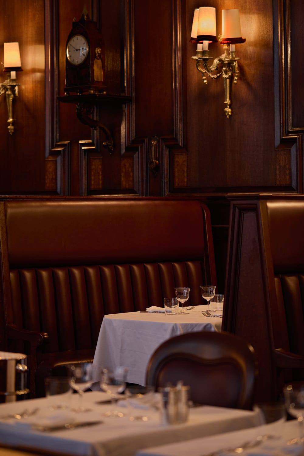 Bespoke banquette seating and wall panelling at Grand Divan London
