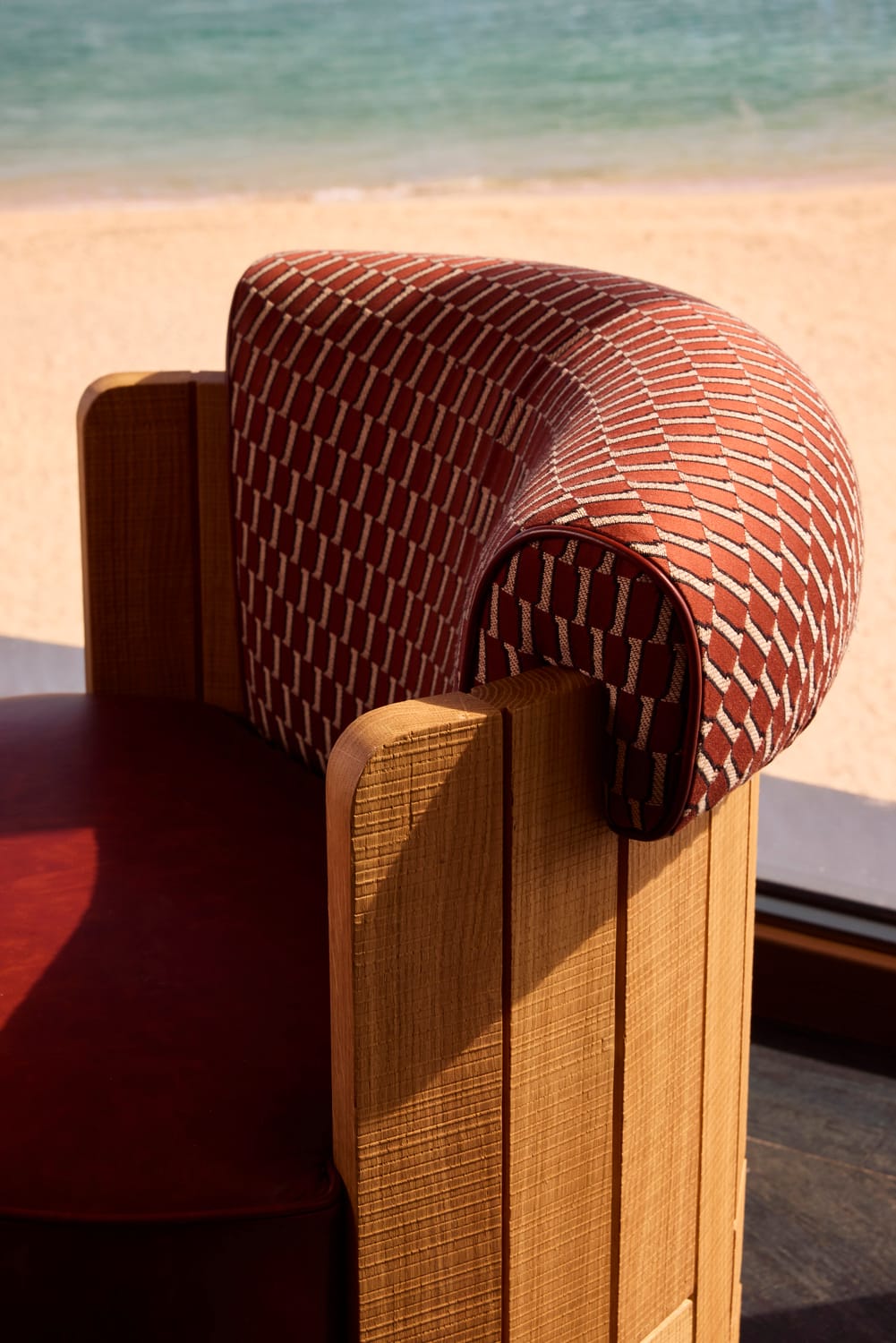 Patterned upholstery and sawn oak armchair detail at MOR