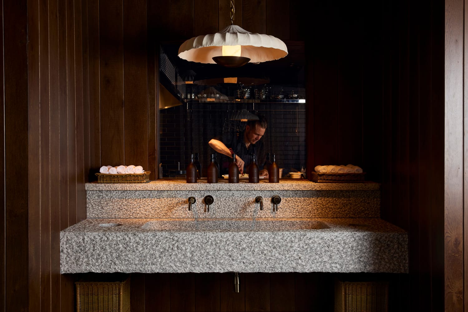 Granite washbasin and sculpted plaster pendant at MOR Carbis Bay