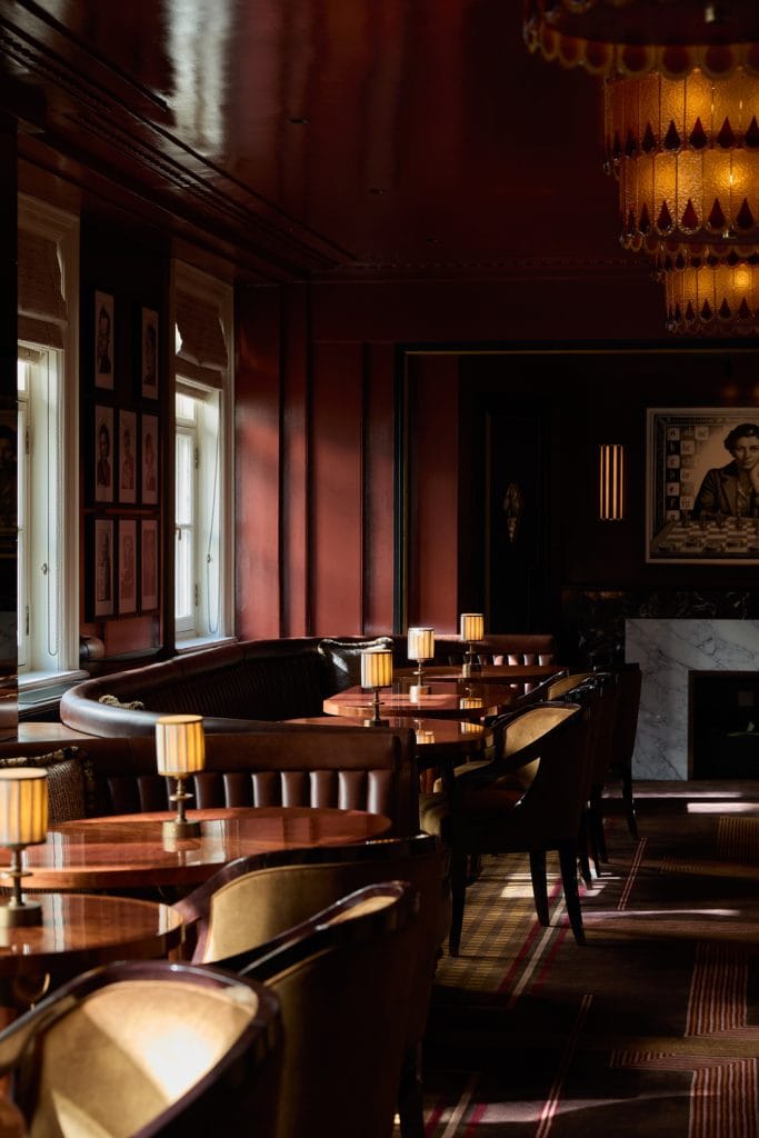 Daylit window seating with armchairs at Simpson's Bar in the Strand